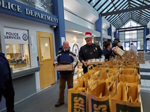 Pastor Carlos Ancheta helped the Fond du Lac Police Department on December 22, 2022, with sorting and packing groceries for the needy families of those who signed up through the FDL Schools.