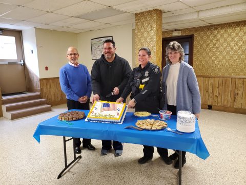Cutting cake with Chief Goldstein, one of the Officers present, Pastor Carlos Ancheta and Vickie Mally, Community Service Leader